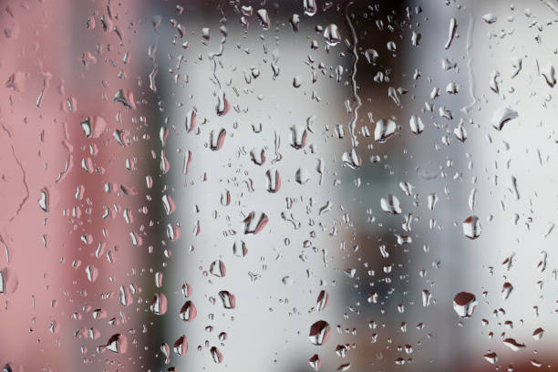 Rain drops on window , rainy day stock photo