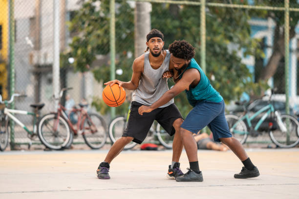 istock Men playing street basketball 1389172999