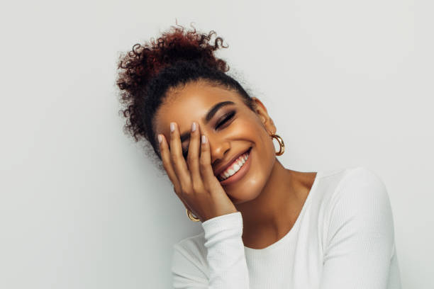 istock Beautiful smiling girl with curly hairstyle 1389175046