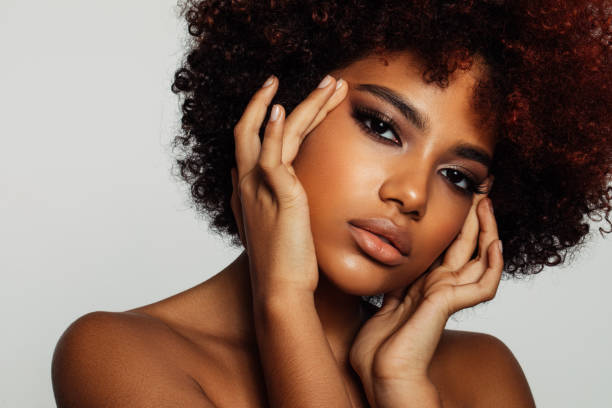 istock Beautiful afro woman with perfect make-up 1389175054