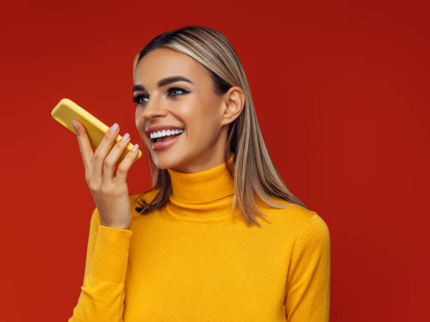 istock Beautiful emotional woman using smart phone 1389175712