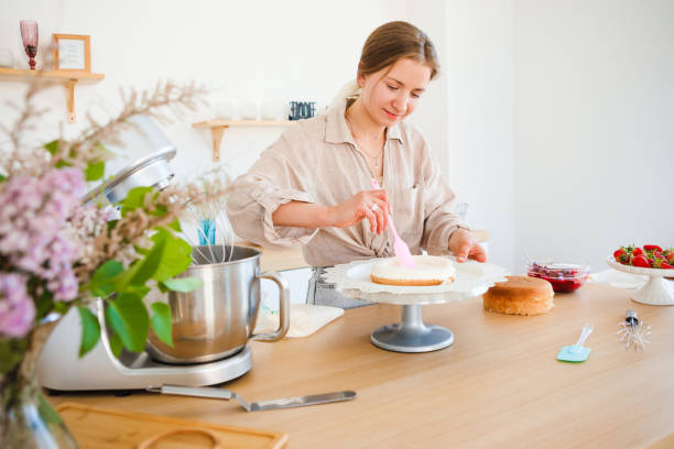 istock A pastry chef bakes a cake in the home kitchen. Home business. 1389178270