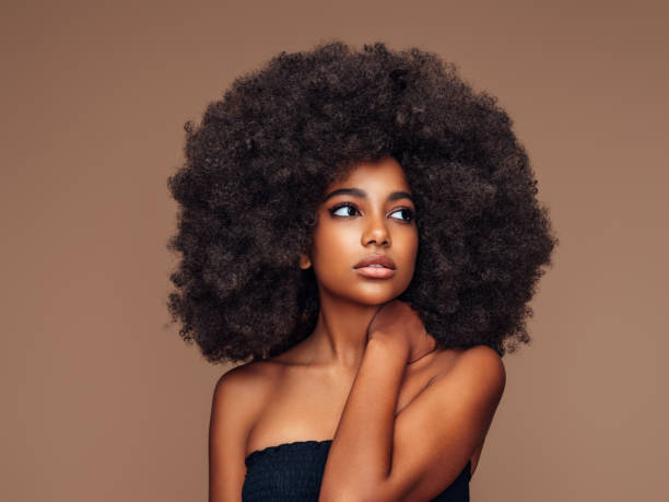 istock Beautiful girl with curly hairstyle 1389179952