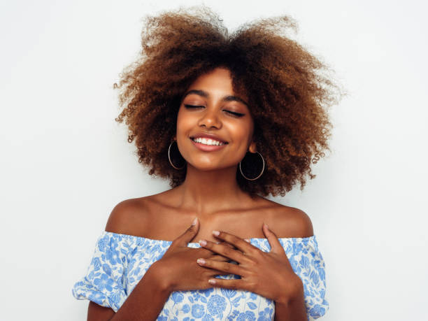 istock Beautiful smiling girl with curly hairstyle 1389179991