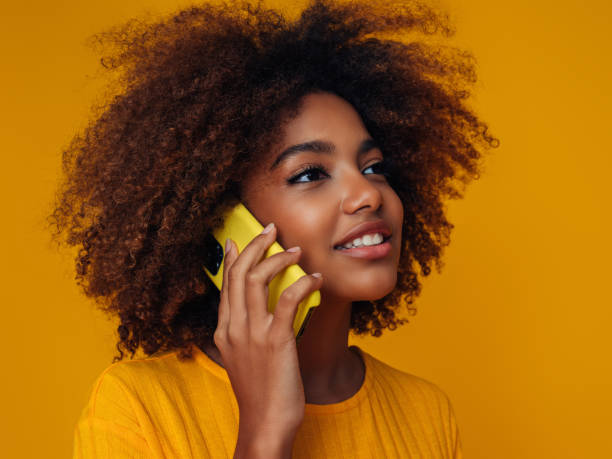 istock Woman holding a smart phone 1389180073