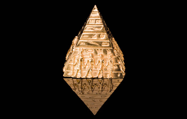 Golden pyramid with hieroglyphs on a black  background