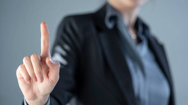 istock Female finger pressing a search button on a digital screen 1389183452