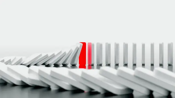 Photo of domino effect in action is stopped (3d rendering)