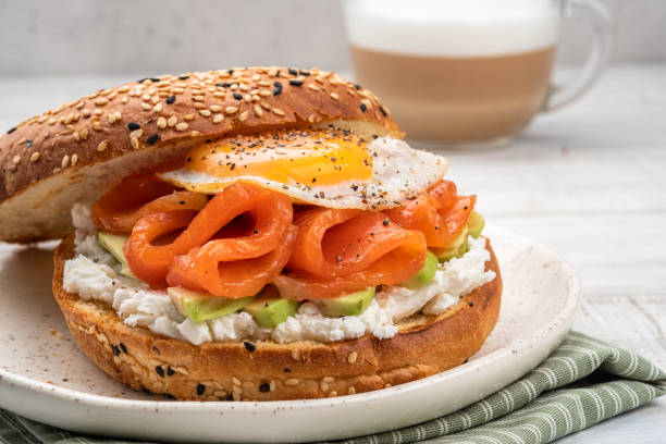 istock Bagel sandwich with salmon, cream cheese, avocado and egg. 1389184671