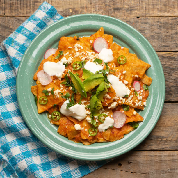 istock Red chilaquiles with cheese and avocado. Mexican food 1389184708