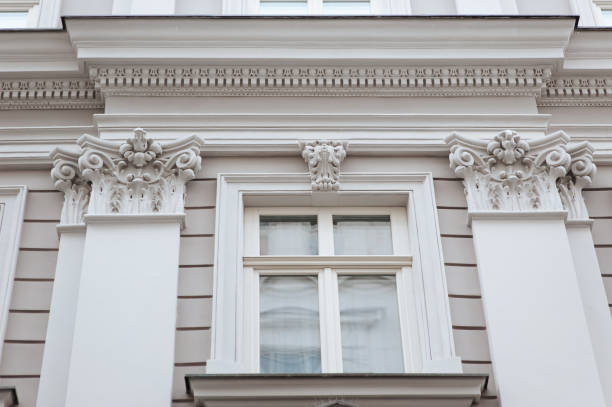 istock Window with wooden frame. Neoclassical building with a complex structure with pilasters and capitals in the Corinthian style. Light gray facade of an old house in Lviv, Ukraine. 1389184739