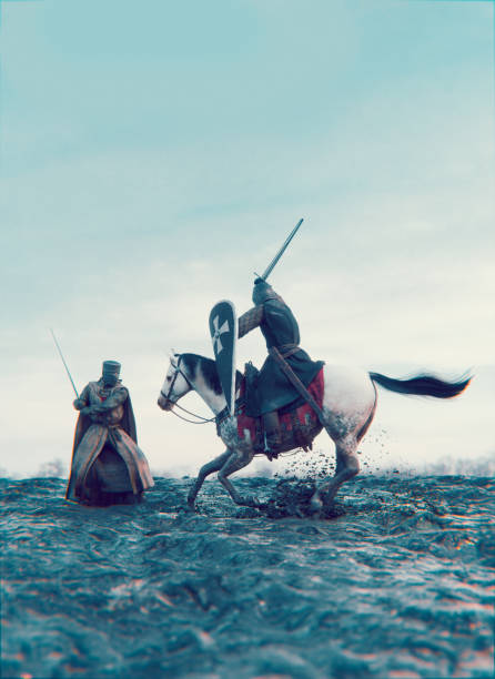 istock Medieval sword fight between two men wearing armor 1389184804