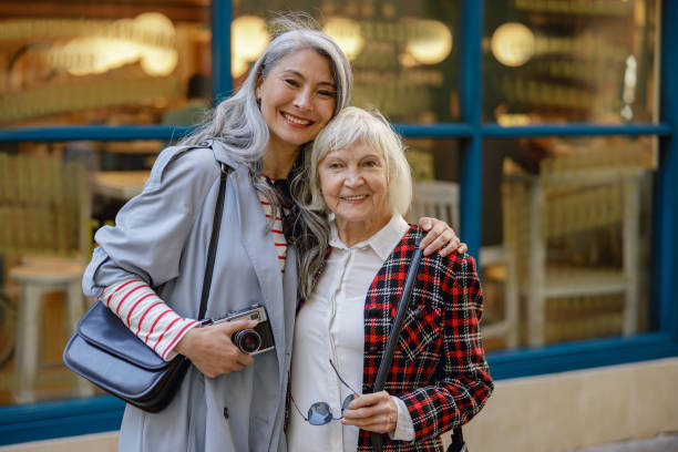 istock Enthusiastic women spending time together in city 1389185599