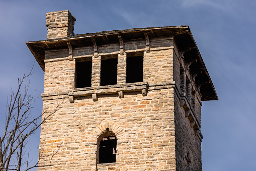 The top floor with windows and chimney of an abandoned water tower at Ha Ha Tonka State Park, Missouri