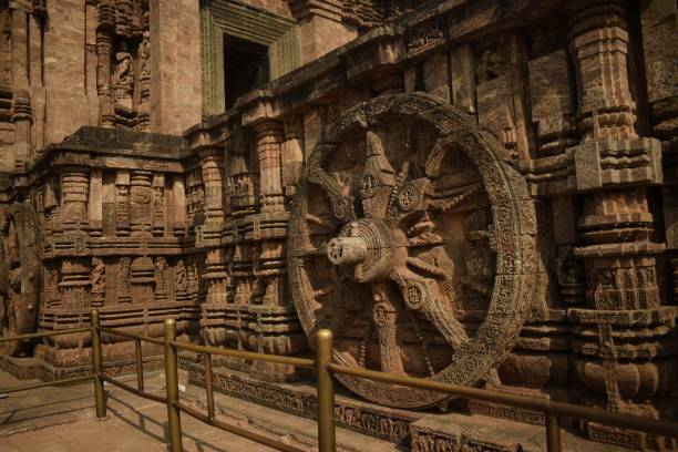 the giant wheel konark, odisha, india - march 17, 2022 : the giant wheel of the stone chariot at konark sun temple where the main structure resembles a chariot shape chariot wheel at konark sun temple india stock pictures, royalty-free photos & images