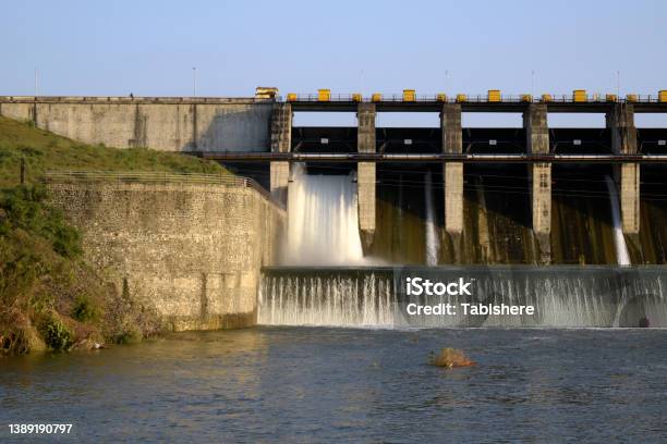 Aerial Panoramic View Of Concrete Dam At Reservoir With Flowing Water Hydroelectricity Power Station Drone Shot Stock Photo - Download Image Now
