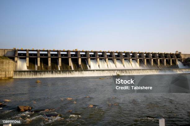 Dam Water Releasethe Excess Capacity Of The Dam Until Springway Overflows Stock Photo - Download Image Now