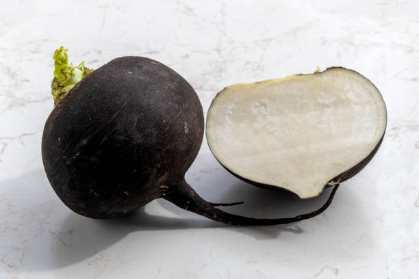 istock Black radish. Raphanus sativus L. On marble background 1389191751