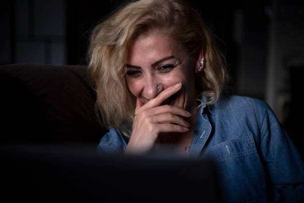 woman watching movie on laptop computer