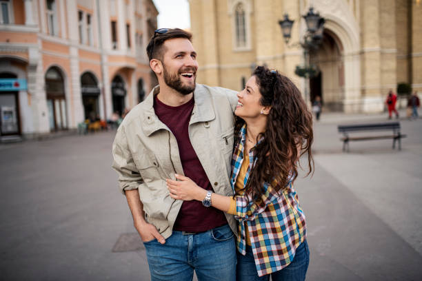 istock Young couple outdoors having great time 1389198283