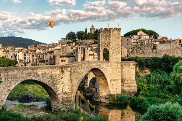 Balloon trip over the medieval village of Besalú en Girona, Catalonia, Spain. Foreground of medieval bridge - Nacional park of Garrotxa