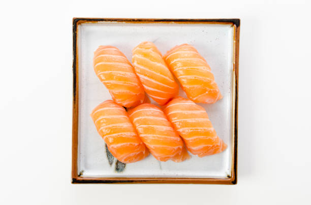 istock Salmon sushi nigiri on white background 1389199762