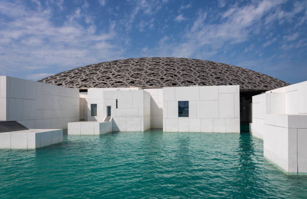 Exterior of the Louvre museum in Abu Dhabi with its impressive roof, UAE stock photo
