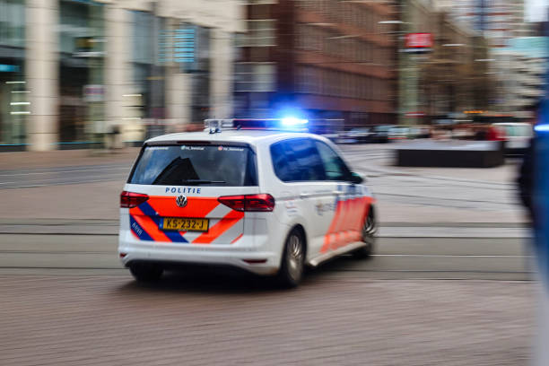 police car rushing with siren on the street stock photo