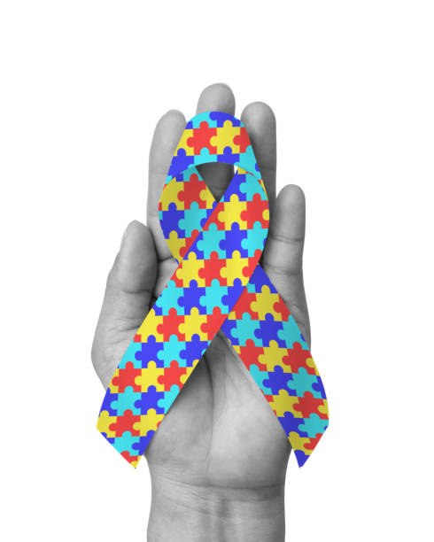 istock World Autism Awareness day with puzzle or jigsaw pattern ribbon isolated with clipping path on white background for mental health care concept for autistic children and adult 1389207179
