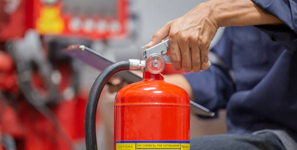 istock Engineer are checking and inspection a fire extinguishers tank in the fire control room for safety training and fire prevention. 1389214501
