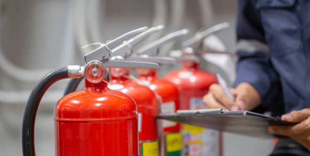 istock Engineer are checking and inspection a fire extinguishers tank in the fire control room for safety training and fire prevention. 1389214503