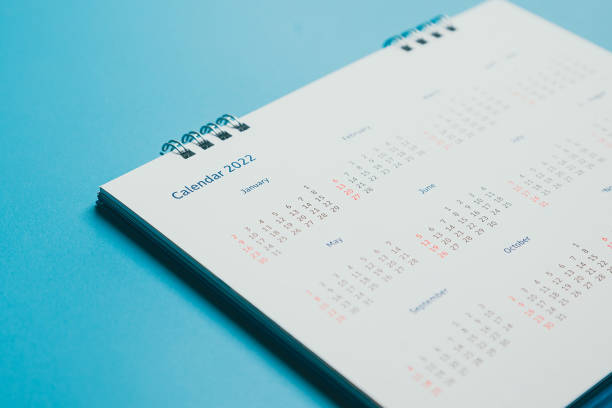 istock Close top view on white calendar 2022 month schedule Work planning and life concept. 1389214580