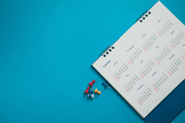 istock Close top view on white calendar 2022 month schedule Work planning and life concept. 1389214592