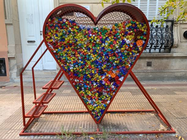 istock Heart contener of colored plastic caps 1389223057