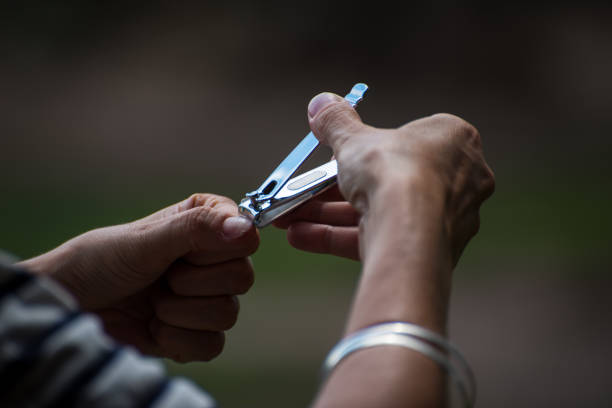 istock hands cutting nails, nippers, nail clippers 1389234465