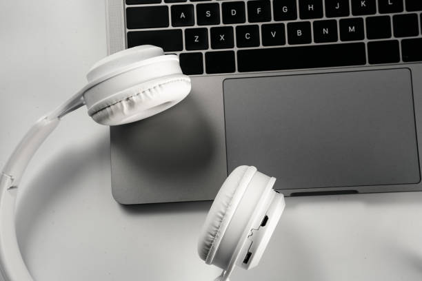 Computers and headphones on a white background