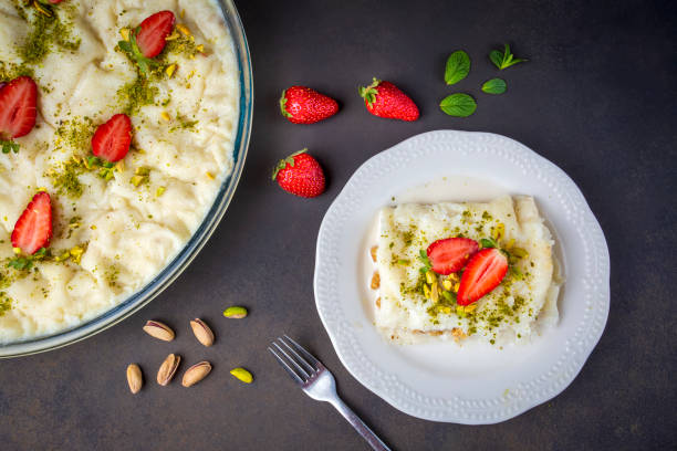 Close-up walnut gullac dessert. Traditional Ramadan dessert. Middle Eastern desserts. Close-up walnut gullac dessert. Traditional Ramadan dessert. Middle Eastern desserts. turkey middle east stock pictures, royalty-free photos & images