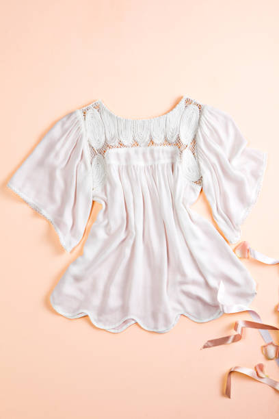 istock Fashionable white blouse on colored background 1389249830