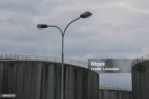 Concreted Storage Silos For Fossil Fuels Stock Photo - Download Image Now - Crisis, Factory, Fuel and Power Generation