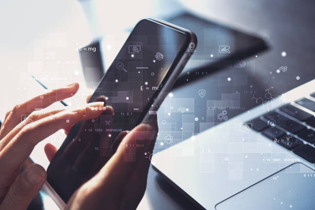 istock IoT, Internet of Things, global network, E-learning, online study concept. Business woman using mobile phone and laptop computer with technology icons 1389257422