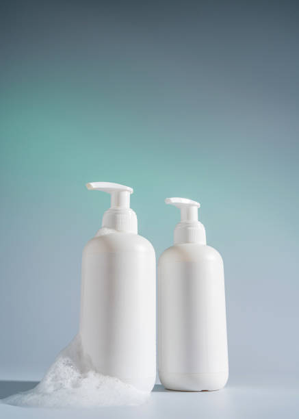 istock Blank white Bottles for Shampoo, Mock up Cream Jar on a blue light background, Packaging for Shampoo without logo and label 1389257503