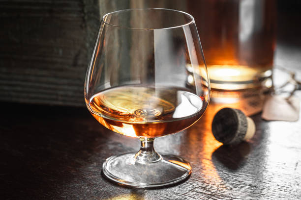 istock Old whisky with ice in a glass in the distillery. 1389261982