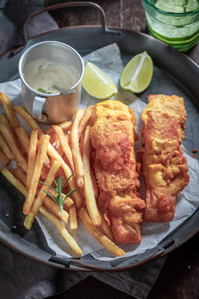 istock Hot fish and chips served with lime and salt. 1389262468