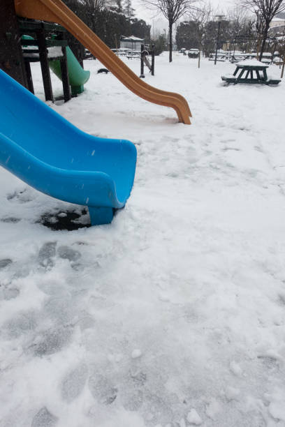 istock Slide at the Playground Outdoors in Winter 1389262530
