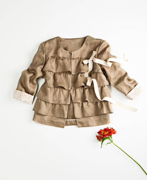 istock Fashionable brown jacket with single flower 1389262662