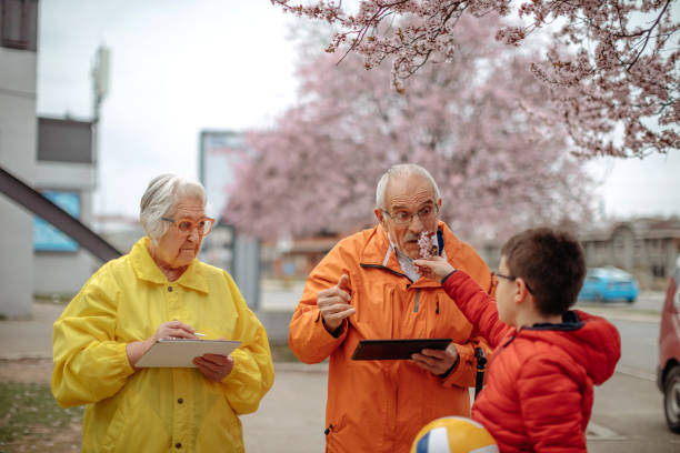 istock Old people walking in the spring holding digital tablets 1389270411