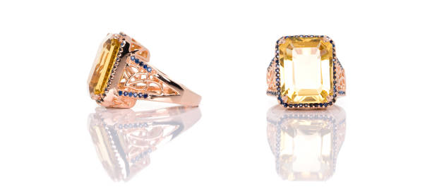 istock Citrine with Blue Sapphire ring on white background with reflection. Collection of natural gemstones accessories. Studio shot 1389270501
