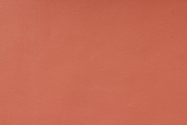 istock Part of a peach colored concrete wall 1389272325
