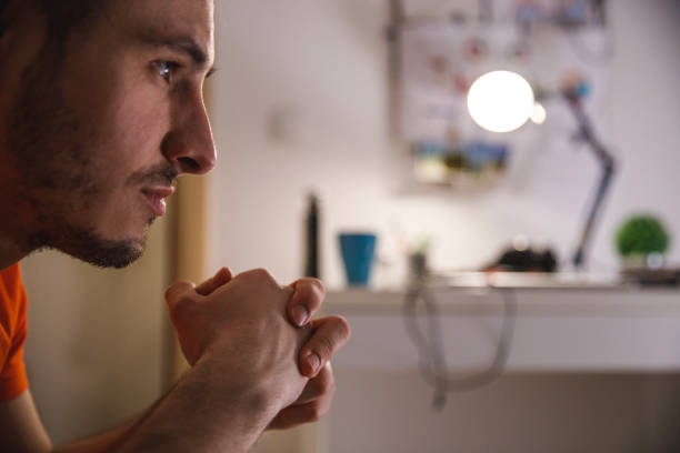 istock Profile view of serious young man cracking knuckles and contemplating 1389274824