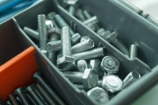 Small fastening bolts for a hex wrench in the slot of the tool box. Stock of fasteners for repair. Selective focus Small fastening bolts for a hex wrench in the slot of the tool box. Stock of fasteners for repair. Selective focus. bolt fastener stock pictures, royalty-free photos & images